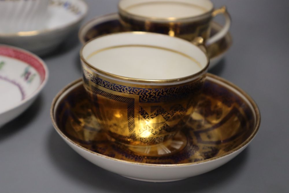 A pair of Miles Mason blue and gilt teacups and saucer, a documentary London handle cup and saucer pattern 2/1486 dated 1825